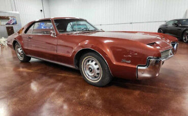 Oldsmobile-Toronado-Coupe-1966-Burgundy-Burgundy-0-4