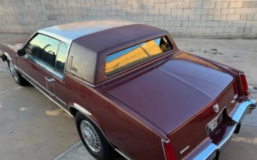 Cadillac-Eldorado-biarritz-stainless-roof-1982-red-135185