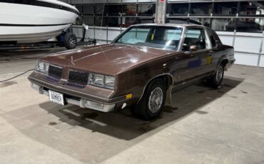 Oldsmobile-Cutlass-supreme-1983-brown-183524